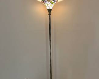 Tiffany style floor lamp featuring a colorful floral-patterned stained glass shade