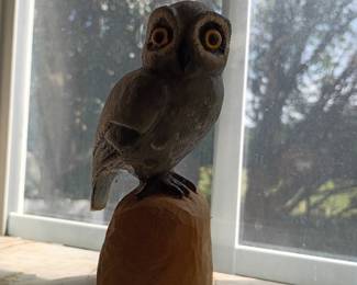 Carved owl figurine on wood base