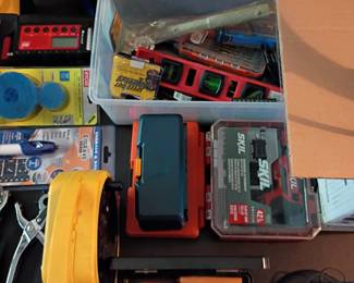 Mixed tool box: SKIL tools, tape, hardware