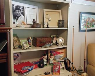 Display shelf with sports memorabilia and collectibles