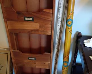 Tiered wood storage bin with walking sticks