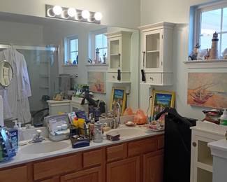 Bathroom vanity with personal care items and decor