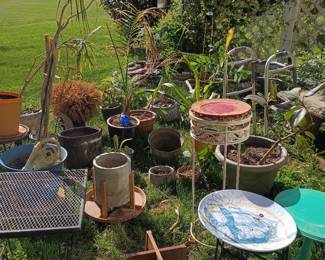 Garden area with assorted planters, pots, and outdoor decor