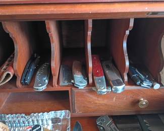 Vintage pocket knife collection in desk cubbies