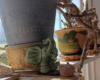 Decorative planters with jade plant and elephant figurine