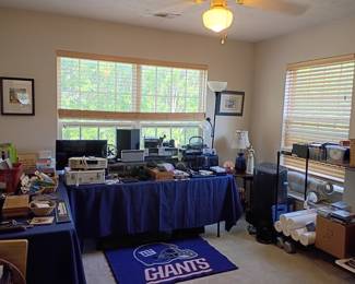 Hobby room with NY Giants rug and electronics