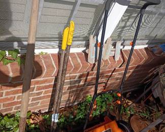 LawnMaster electric lawn mower with long-handled yard tools