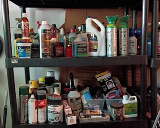 Garage shelf with automotive fluids, lubricants, and chemicals