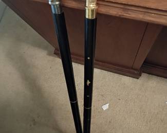 Pair of vintage walking canes with ornate figural handles