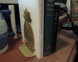 Brass pineapple bookend with hardcover books