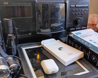Apple AirPods, JVC player, tablet, and electronics