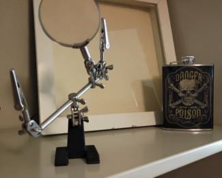 Helping hands magnifier and decorative flask