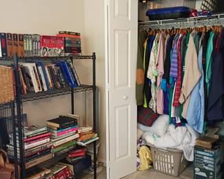 Bookshelf with books and closet of clothing