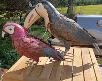 Pair of painted metal tropical bird sculptures: parrot and toucan