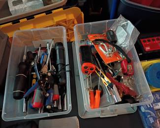 Bins of hand tools: screwdrivers, pliers, multi-tools