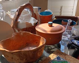 Wood serving bowls, terra cotta tagine, and baskets