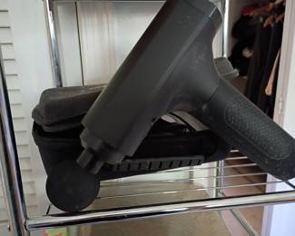 Theragun-style percussion massage gun with case