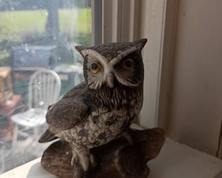 Ceramic owl figurine on log base