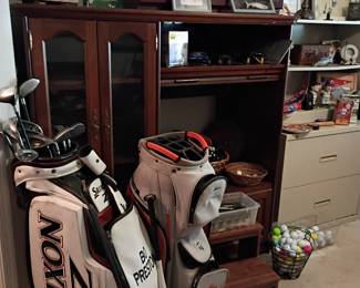 Srixon and Pro Select golf bags with clubs
