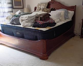 Carved wood bed frame with pillowtop mattress
