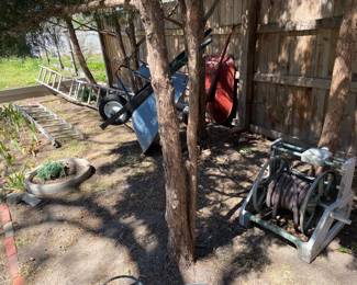 Garden hoses, hose cart, wheel barrows