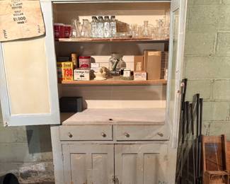 Glass door cabinet with industrial Pyrex items 