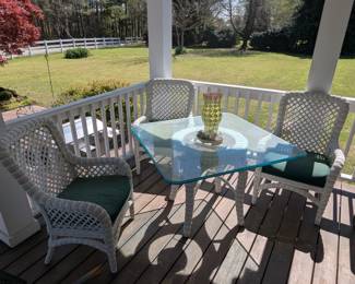 Outdoor wicker and glass dining table. 