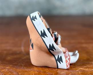 This lot features an original sculpture signed by artist, Loretto and measures, 3.25” H.