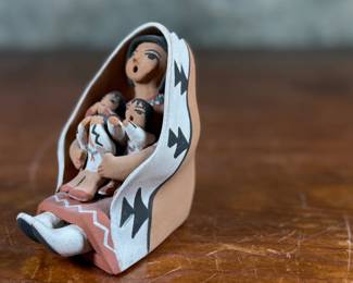 This lot features an original sculpture signed by artist, Loretto and measures, 3.25” H.