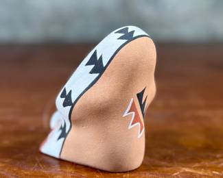 This lot features an original sculpture signed by artist, Loretto and measures, 3.25” H.