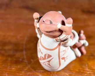 This lot features an original sculpture by listed Pueblo artist, Lupe Lucero Loretto. Signed underneath and measures, 5.25” H.