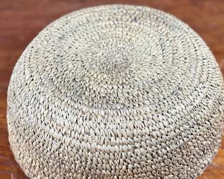 This lot features a turn of the century basket made of cedar root from the Cascades Plateau region, likely from the late 19th century or early 20th century. Measures, 3.5” H x 10” W x 10” D.