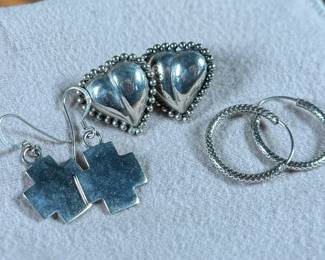 This lot features three (3) pairs of sterling silver earrings with a total approx. weight of 15.29 grams.