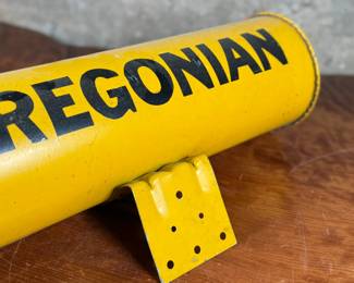 This lot features an original vintage newspaper holder with “OREGONIAN” written across.