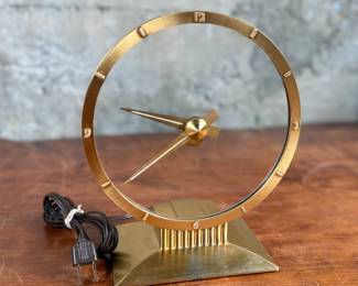 Jefferson ‘Golden Hour’ electric clock, manufactured by Jefferson Electric Company, Bellwood, Illinois. Features a brass-tone finish and an open-circle design with a 9” height. Operates using 110-120V AC, 2-5 watts. Includes plug-in cord. Tested and in working condition.