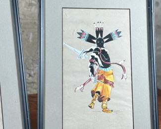 This lot features a pair of Native American paintings, likely depicting Apache Gaan dancers. Each piece measures in frame, 15” H x 10.25” W.