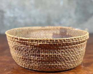 This lot features a Papago squash blossom basket from the early 20th century. Measures, 3.5” H x 9.25” W x 9.25” D.