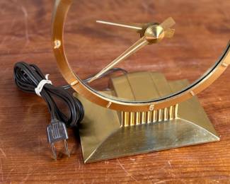 Jefferson ‘Golden Hour’ electric clock, manufactured by Jefferson Electric Company, Bellwood, Illinois. Features a brass-tone finish and an open-circle design with a 9” height. Operates using 110-120V AC, 2-5 watts. Includes plug-in cord. Tested and in working condition.