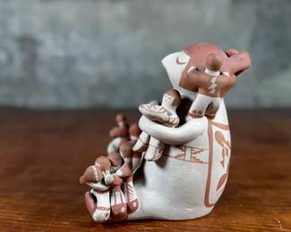 This lot features an original sculpture by listed Pueblo artist, Lupe Lucero Loretto. Signed underneath and measures, 5.25” H.