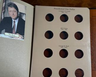 Complete 2007-2016 Presidential Dollar PDS 117-coin set featuring both brilliant uncirculated and proof coins. Coins are arranged in a dedicated album, with additional display cases for select presidential sets, including Richard Nixon, Gerald Ford, and Ronald Reagan. Includes original invoice indicating the purchase price of $339. Some missing as shown in photos.