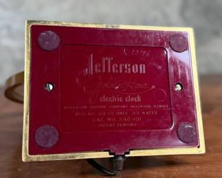 Jefferson ‘Golden Hour’ electric clock, manufactured by Jefferson Electric Company, Bellwood, Illinois. Features a brass-tone finish and an open-circle design with a 9” height. Operates using 110-120V AC, 2-5 watts. Includes plug-in cord. Tested and in working condition.
