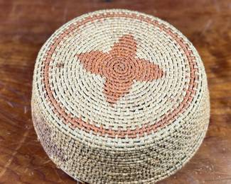 This lot features a Papago squash blossom basket from the early 20th century. Measures, 3.5” H x 9.25” W x 9.25” D.