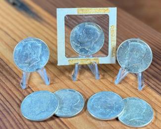 This lot features seven (7) 90% silver Kennedy half dollars.