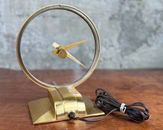 Jefferson ‘Golden Hour’ electric clock, manufactured by Jefferson Electric Company, Bellwood, Illinois. Features a brass-tone finish and an open-circle design with a 9” height. Operates using 110-120V AC, 2-5 watts. Includes plug-in cord. Tested and in working condition.