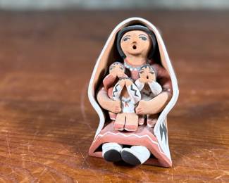 This lot features an original sculpture signed by artist, Loretto and measures, 3.25” H.