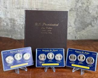 Complete 2007-2016 Presidential Dollar PDS 117-coin set featuring both brilliant uncirculated and proof coins. Coins are arranged in a dedicated album, with additional display cases for select presidential sets, including Richard Nixon, Gerald Ford, and Ronald Reagan. Includes original invoice indicating the purchase price of $339. Some missing as shown in photos.