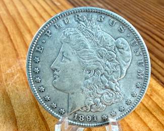 This lot features a 1891-S Morgan Dollar.