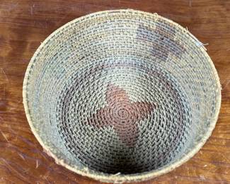This lot features a Papago squash blossom basket from the early 20th century. Measures, 3.5” H x 9.25” W x 9.25” D.