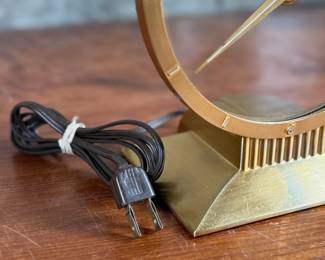 Jefferson ‘Golden Hour’ electric clock, manufactured by Jefferson Electric Company, Bellwood, Illinois. Features a brass-tone finish and an open-circle design with a 9” height. Operates using 110-120V AC, 2-5 watts. Includes plug-in cord. Tested and in working condition.