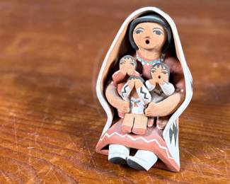 This lot features an original sculpture signed by artist, Loretto and measures, 3.25” H.